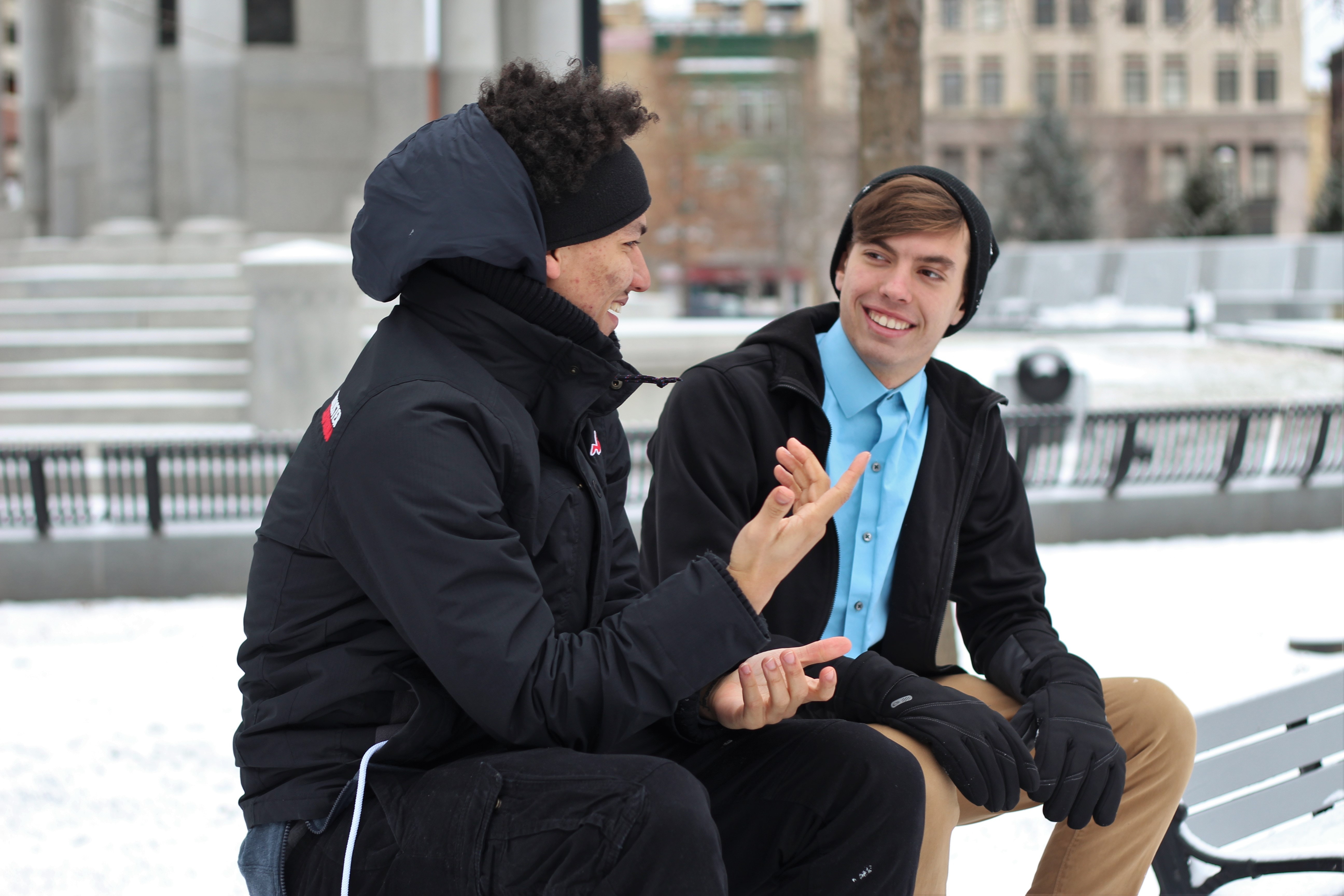 Two guys talking about lessons they learned in communication class