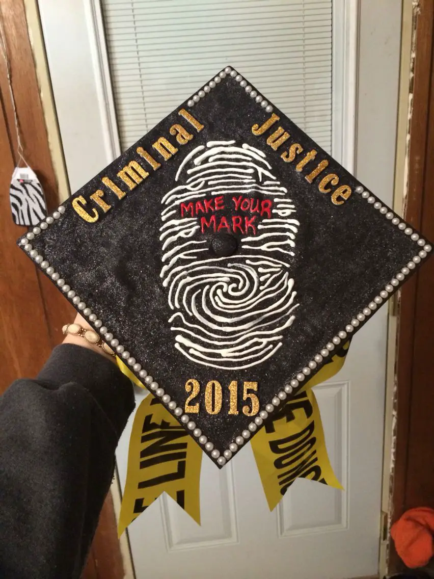 Criminal justice student decorating their graduation cap
