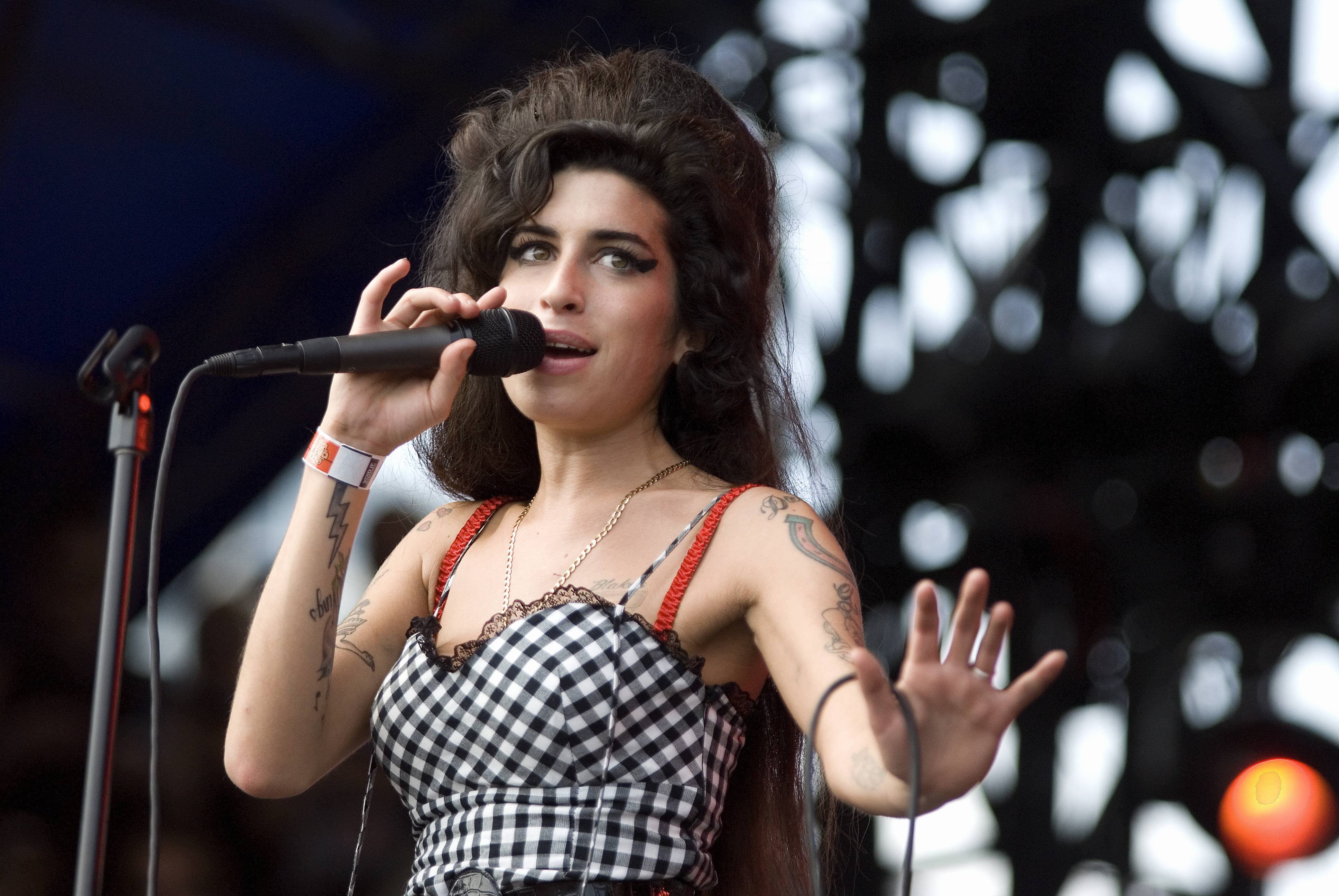 The hologram tour proves that Amy Winehouse simply can't escape exploitation. (Image via Daniel Boczarski/Redferns)