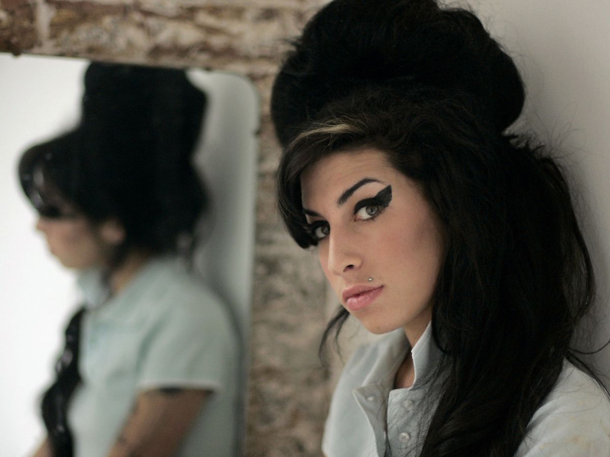 Although she wished to remain out of the spotlight, Winehouse's father disobeyed her wishes. (Image via Manchester Evening News)
