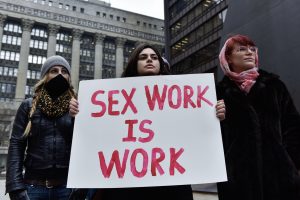 Users of #ThotAudit have been reporting sex workers to the IRS, claiming that sex work "isn't real work." (Image via The Clover Chronicle.)