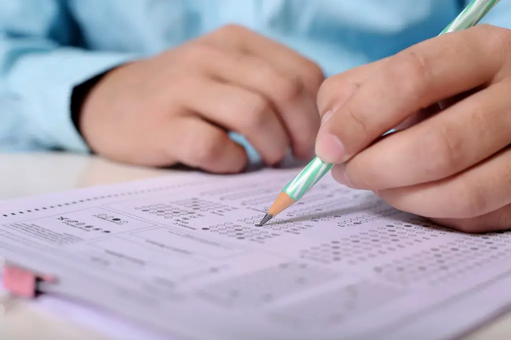 student taking a scantron exam in school
