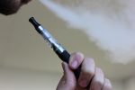Photo of someone vaping in article about EVALI epidemic