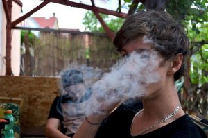 Photo of two young people smoking weed