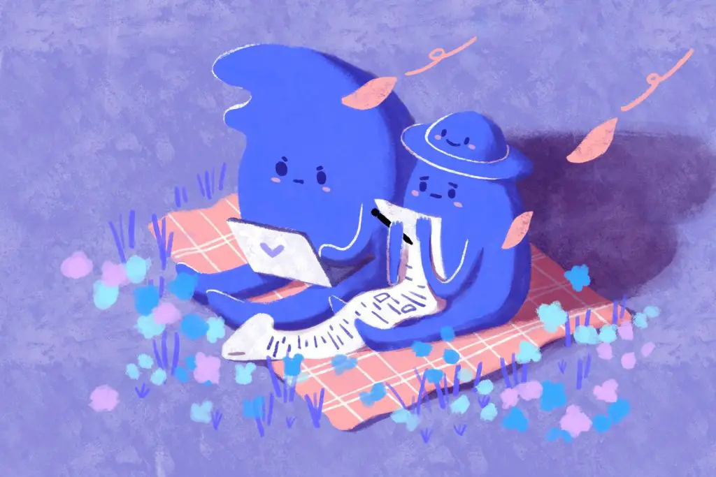 Two blue creatures reading on a picnic blanket in an article about writing