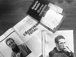 Photo of a Roberto Bolano book along with magazine articles about the author