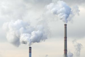 Smoke coming out of building chimneys