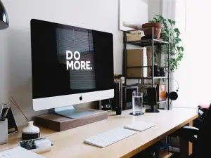 In an article about toxic productivity, the words Do More on a computer screen