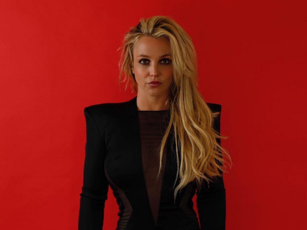 Britney Spears against red background
