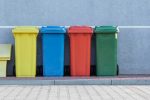 four recycling bins in an article about sustainability