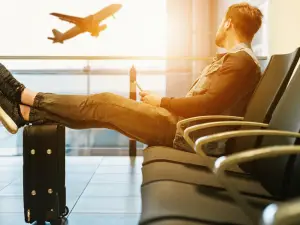 Much like the man pictured above waiting for his flight, the writer of this article reflected on his past and the future ahead amidst the coronavirus while travelling home.