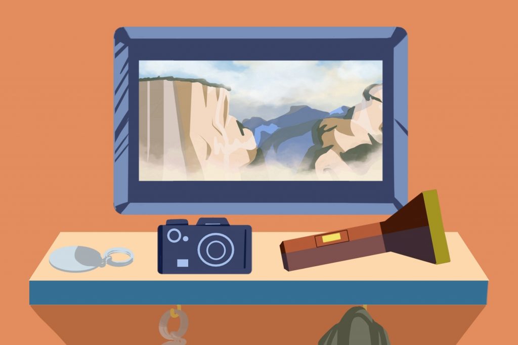 In an article about road trips, an illustration by Elizabeth Wong of a screen with a canyon on it, with a camera and flashlight in front