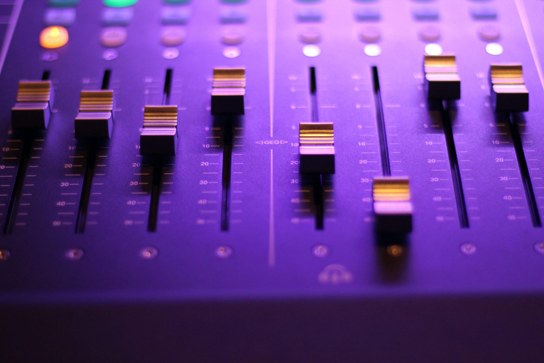 knobs on studio equipment in an article about the music industry