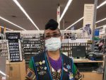 retail worker in one of many essential businesses wearing a mask