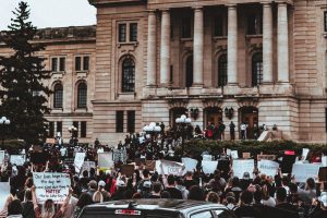 Black Lives Matter protesters in front of a government building.