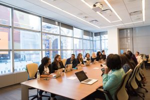 In an article about accountability, an office space with a table full of people