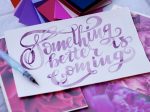 Photo of a card from Unsplash that says "Something better is coming" in article about TikTok's manifestation trend