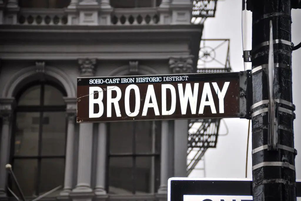 A brown Broadway sign leads the way to the Antonyos.