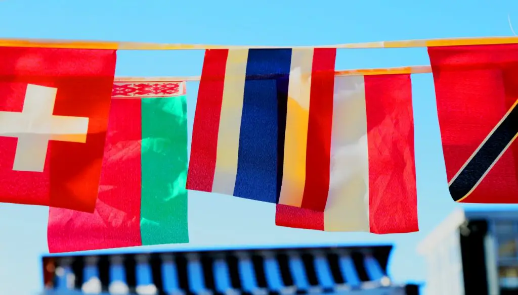 Photo of flags from Unsplash in article about ICE wanting to deport international students