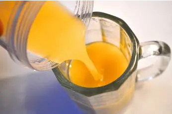 Switchel being poured into a glass