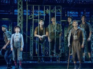 In an article about what to watch after Hamilton, a picture of a production of Newsies