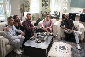 The Fab Five of Queer Eye sit on couches together