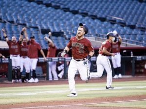 Image of baseball players via MLB instagram in article about sports and COVID-19