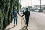 In an article about dating someone entering basic training, a couple holding hands in the street