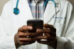 Image of a doctor using a phone for telehealth services