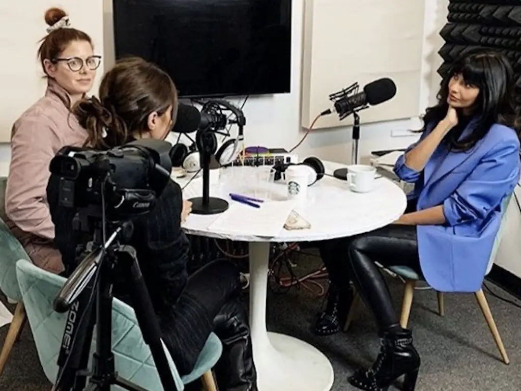 Image of Jameela Jamil hosting podcast I Weigh with Debra Messing