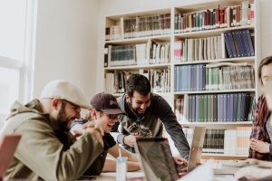 Image of students from Unsplash in article about small-town colleges