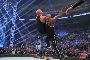 Dwayne "The Rock" Johnson wrestling with someone in the WWE