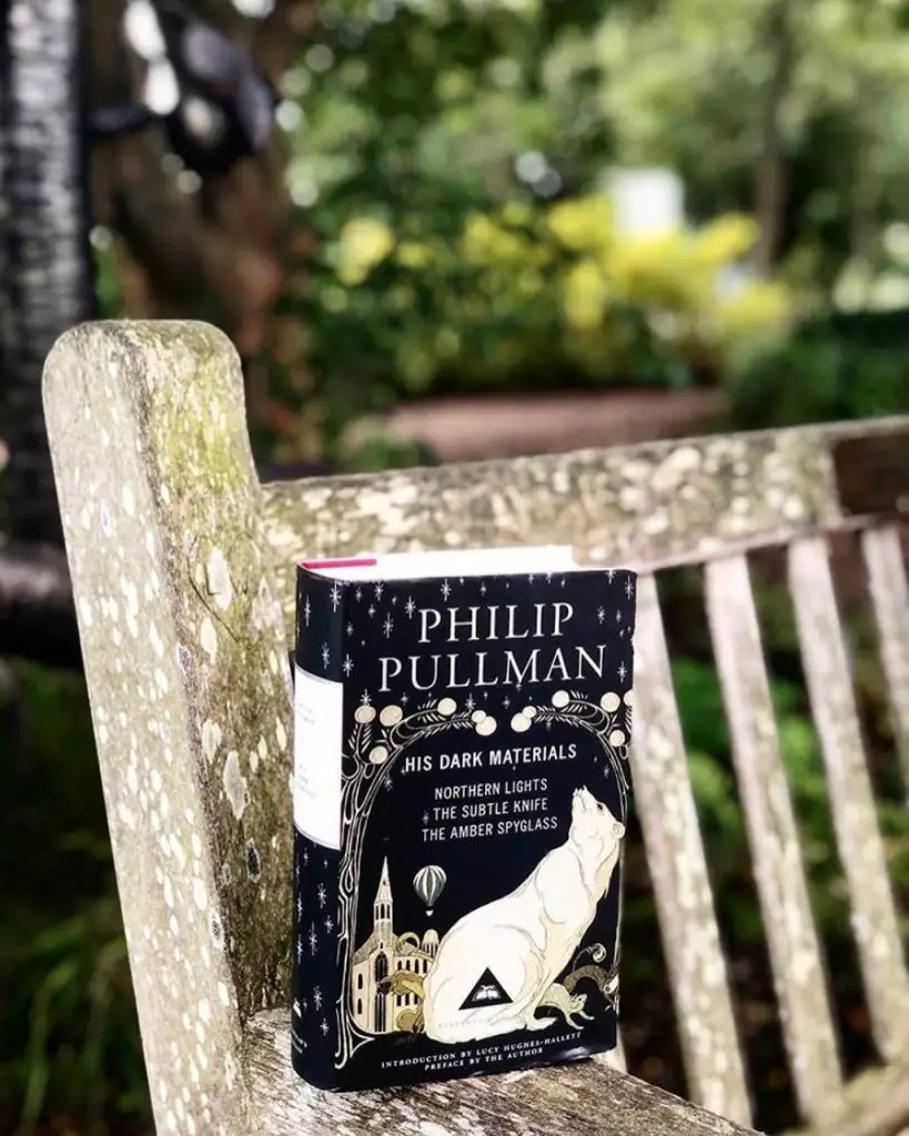 Photo of His Dark Materials collection on a wooden chair
