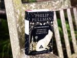 Photo of His Dark Materials collection on a wooden chair