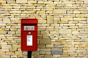 In an article about postal service, a red post box from the UK