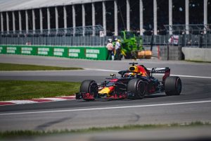 A picture of an F1 racing car going around the track.