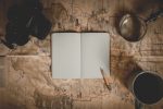In an article about writing your memoir, an open blank notebook