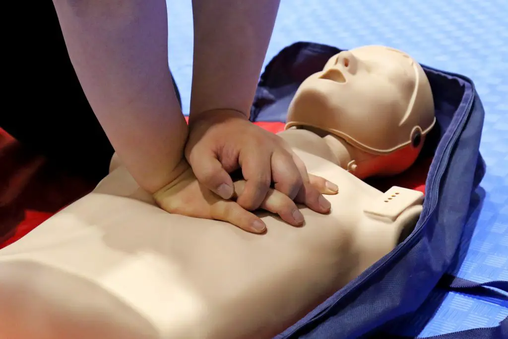 Image of someone performing CPR on a dummy