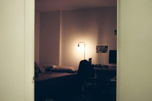 In an article about off-campus housing, a photo of an apartment bedroom