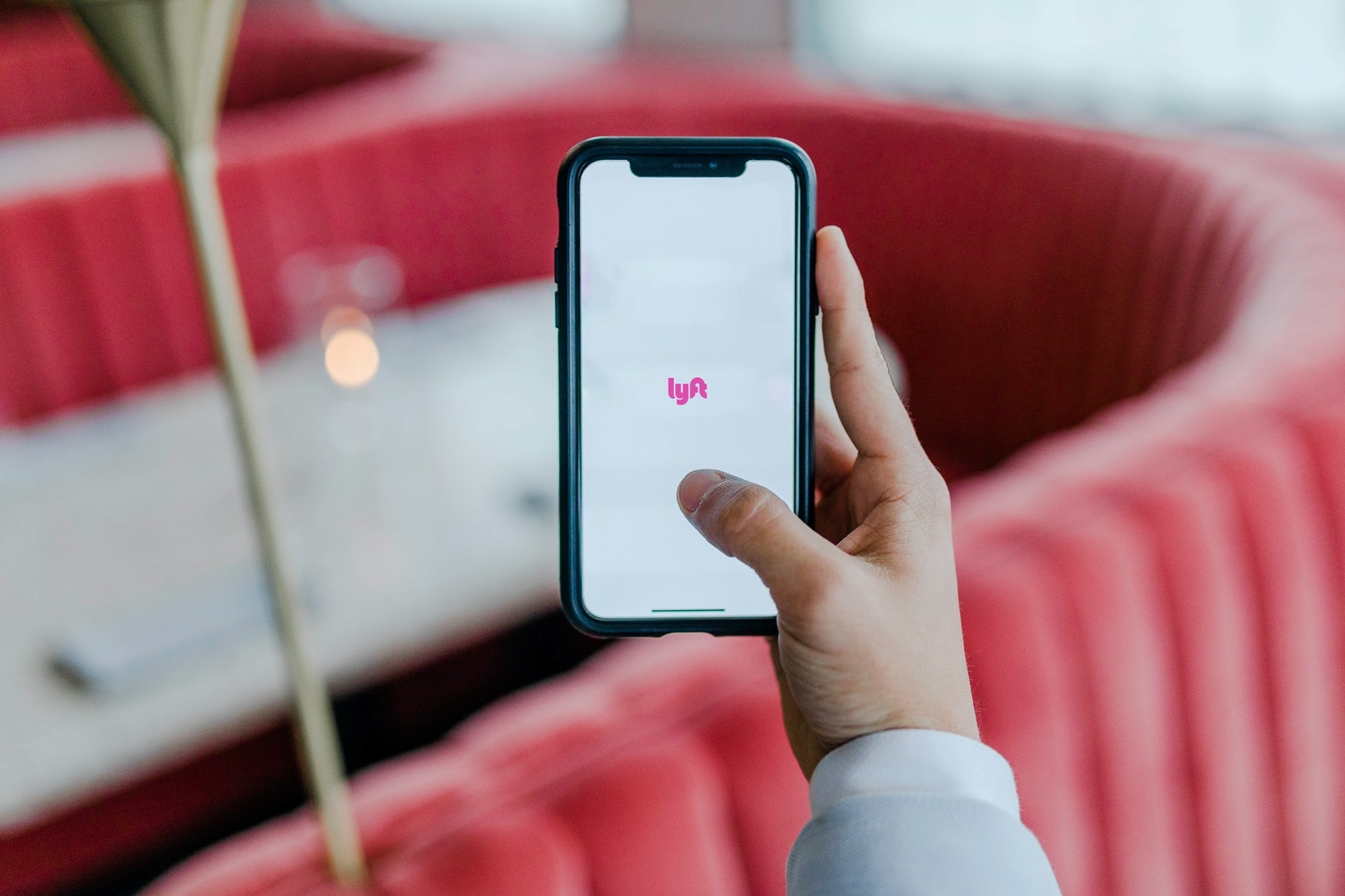 A photo of the Lyft app for an article about the services Zimbabwean origins. (Photo by Austin Distel from Unsplash)