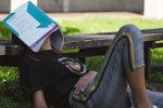 Photo of a girl procrastinating for an article about Coursera and Psychology of Learning. (Photo by Tony Tran from Unsplash)