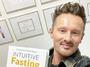 Dr. Will Cole with his book intuitive fasting