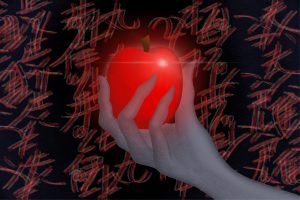 for an article about death note, a hand holding a glowing red apple with scrawled writing in the background