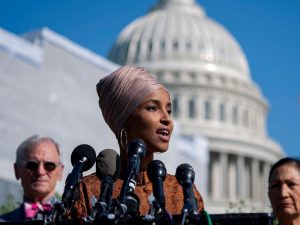 in an article about a possible fourth stimulus check, a picture of Ilhan Omar speaking in front of the Capitol building