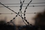 Picture of barbed wire in article about for-profit prisons