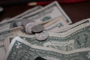 picture of bills and coins in an article about getting a higher salary