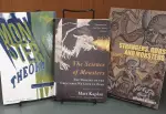 Various books, including Monster Theory