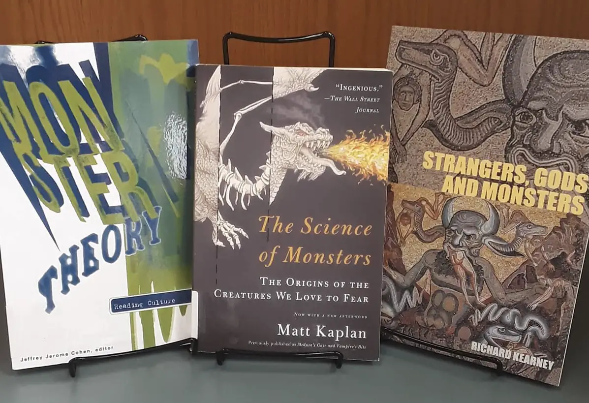 Various books, including Monster Theory