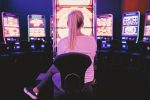 gambling person in front of slot machine