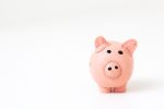 piggy bank in article about traveling on a budget